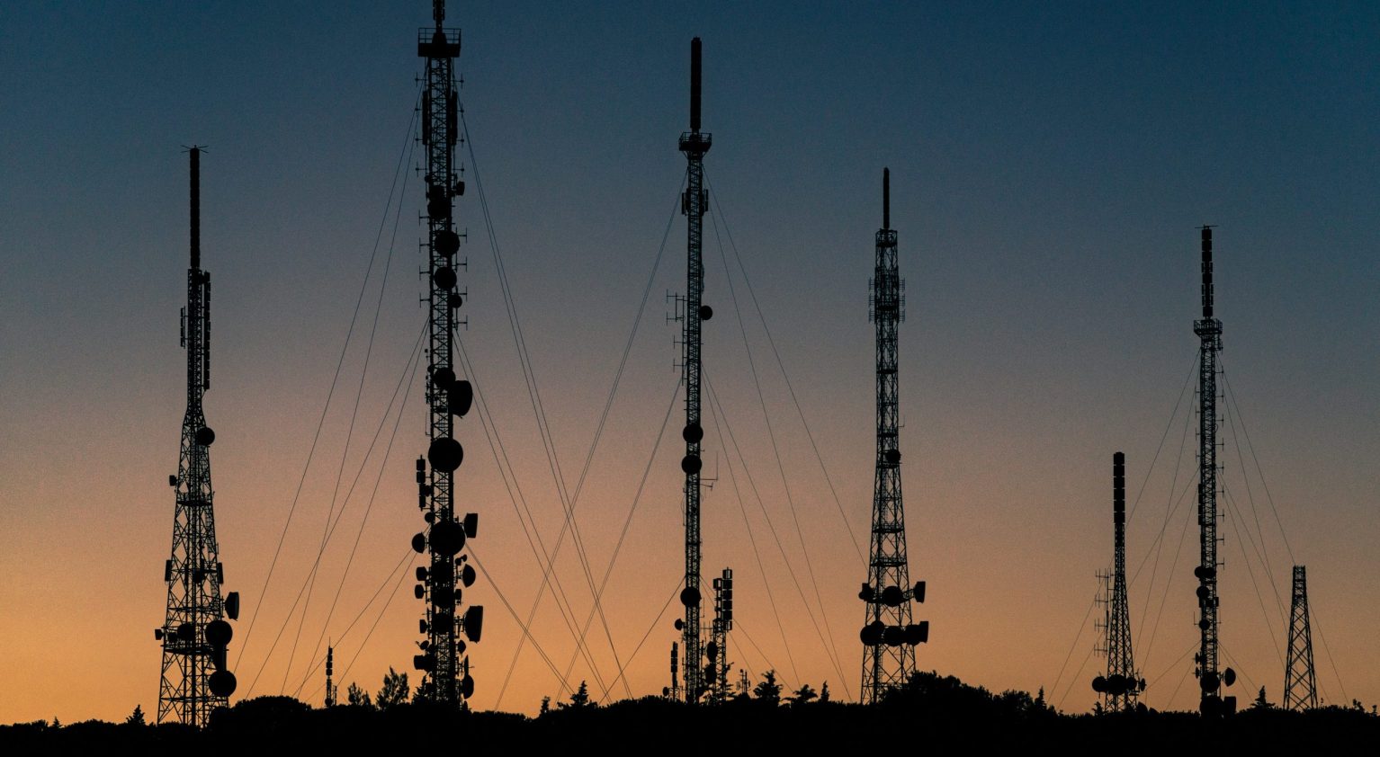 Radio towers at sunset