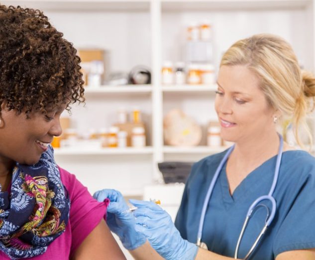 Woman receiving vaccine