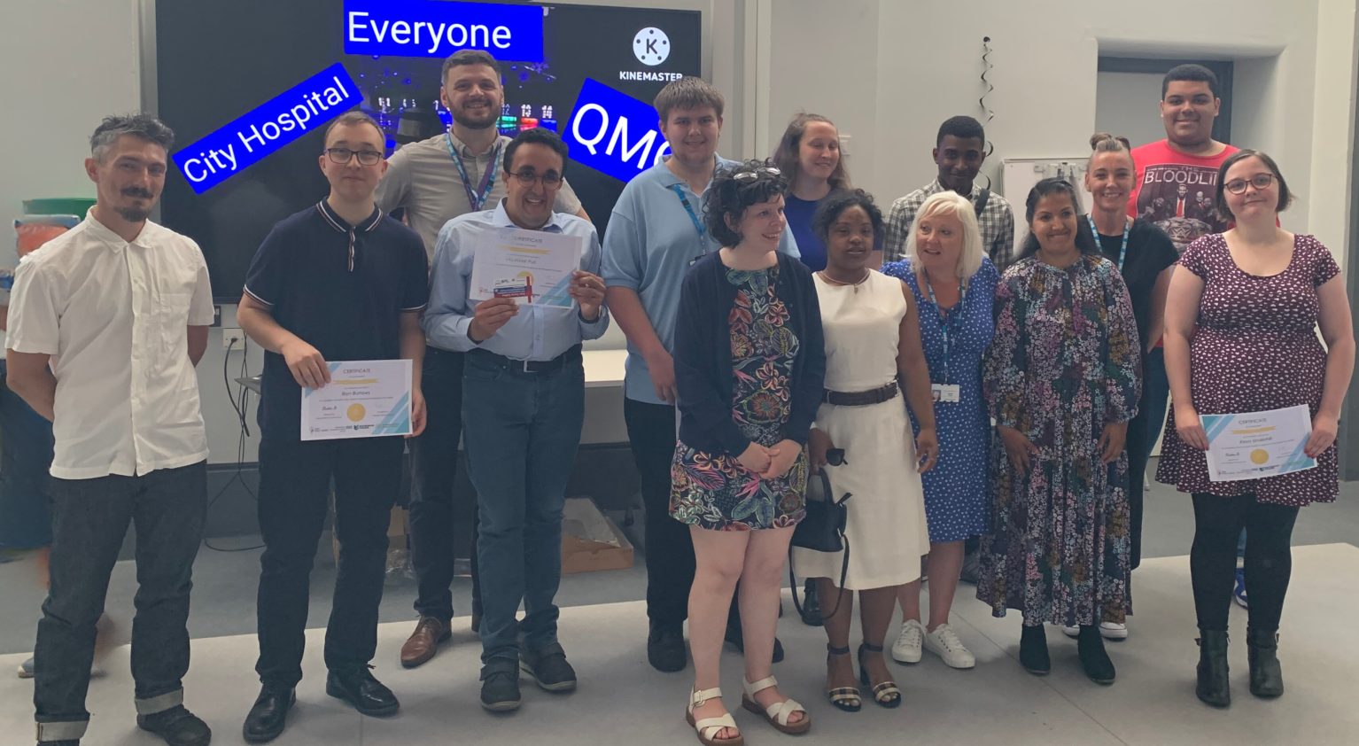 A group of people graduating from the programme