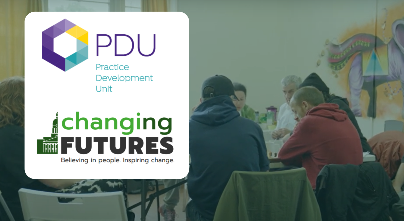 Image shows people round a table at Changing Futures event