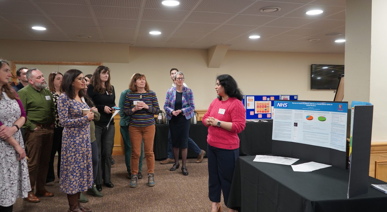 A GP presents her project to the group at the fellowship celebration event