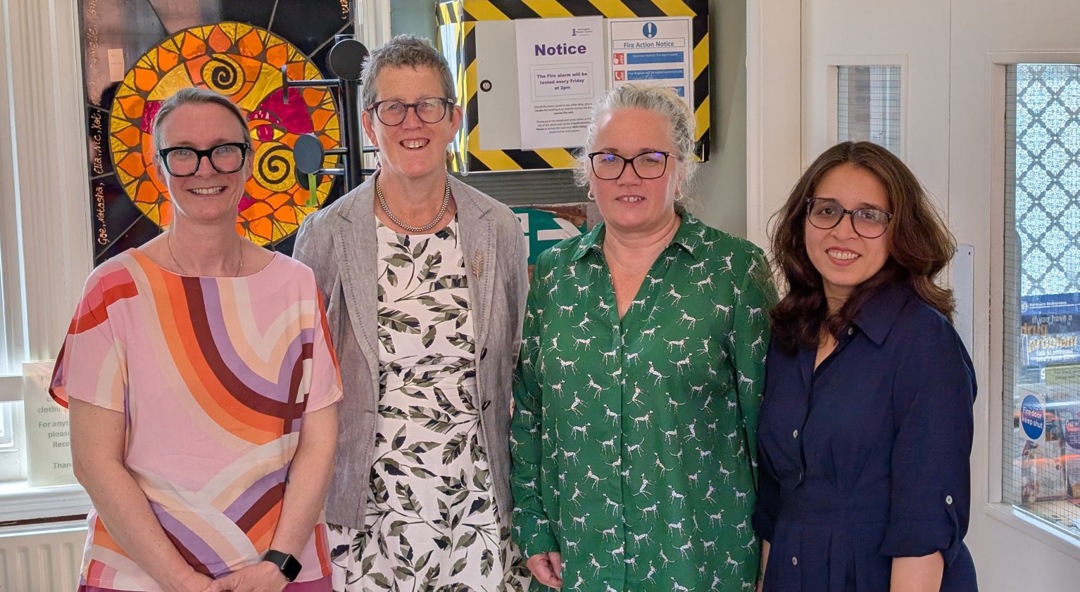Photo of four women smiling at the camera. Caption: Lesley Padley, Head of Therapeutic Services; Dr Kathy McLean, Chair of the ICB; Louisa Matthews, CEO, Nottingham Women's Centre; Zaimal Azad, Head of Policy and Communications