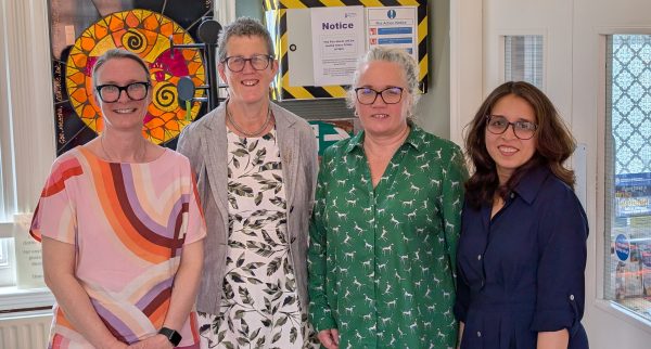 Photo of four women smiling at the camera. Caption: Lesley Padley, Head of Therapeutic Services; Dr Kathy McLean, Chair of the ICB; Louisa Matthews, CEO, Nottingham Women's Centre; Zaimal Azad, Head of Policy and Communications