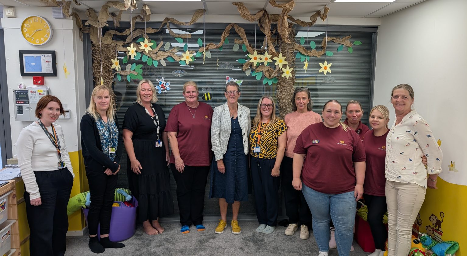 Photo of Dr Kathy McLean with the team from the Toy Library