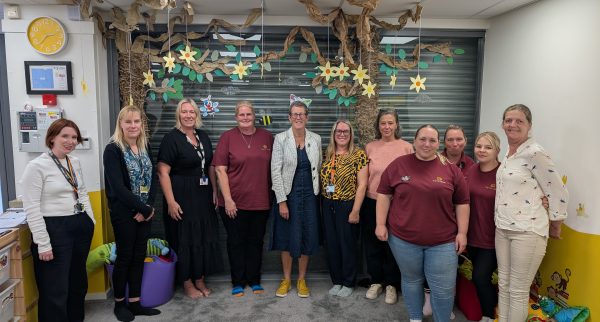 Photo of Dr Kathy McLean with the team from the Toy Library